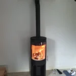 Charlton & Jenrick Purevision vrijstaand rond model hoog open houtvak brandend